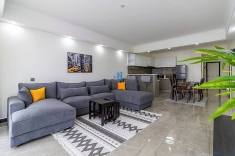 Grey couch with Mustard pillows in the living room area
