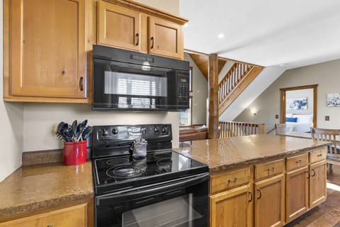 The inviting kitchen offers ample storage & every home comfort