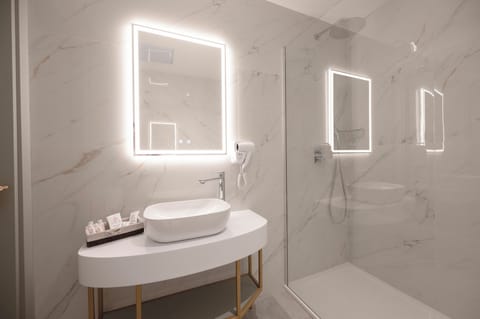 Shower, hair dryer, slippers, towels