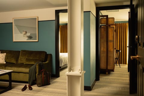 Spacious and stylish suite, where rich textures and deep hues create a cozy yet refined retreat.