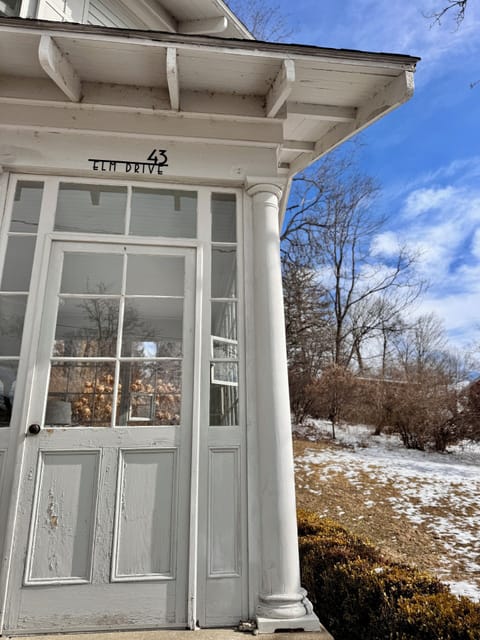 Front entrance is a sun room in the 
winter and porch in the summer.