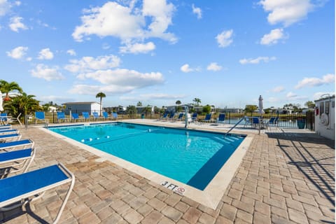 Dive into relaxation with sun-soaked lounging and breezy views!