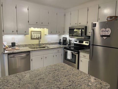 Newly upgraded kitchen with granite countertops and new appliances. 