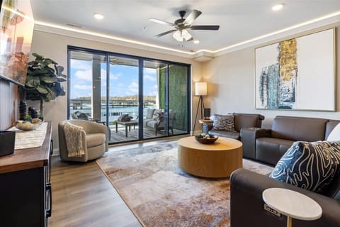 Admire lake vistas & abstract art from this splendid living space.