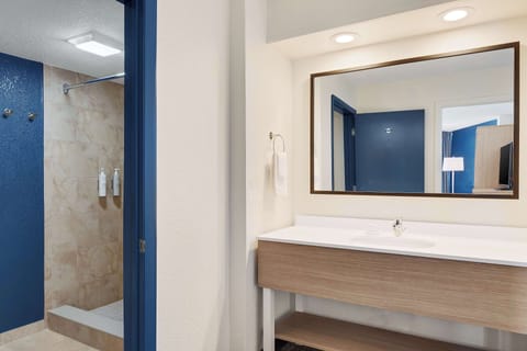 Suite, 1 King Bed | Bathroom | Combined shower/tub, free toiletries, hair dryer, towels