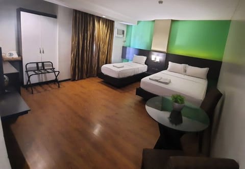Executive Quadruple Room, Non Smoking, City View | Premium bedding, pillowtop beds, desk, free WiFi