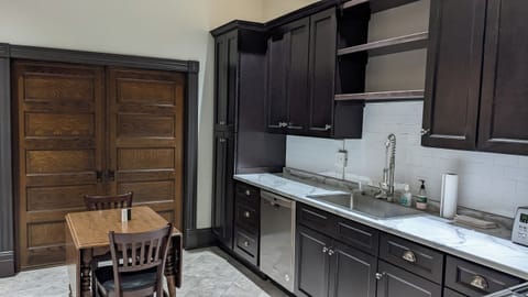 The pocket doors separate the kitchen from the second bedroom