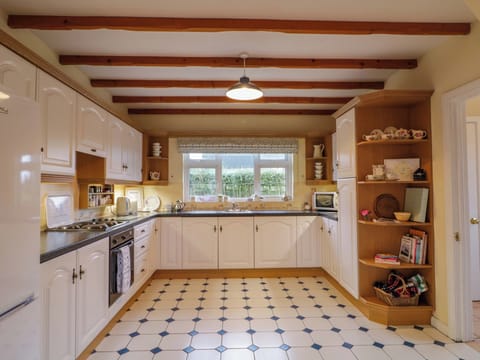 Fridge, electric kettle, toaster, cookware/dishes/utensils