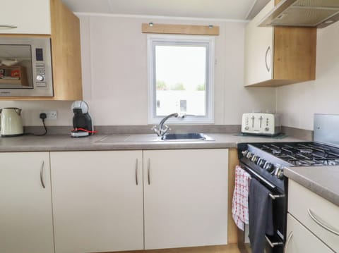 Fridge, electric kettle, toaster, cookware/dishes/utensils