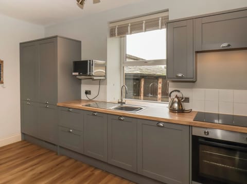 Fridge, electric kettle, toaster, cookware/dishes/utensils