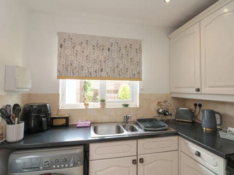 Fridge, electric kettle, toaster, cookware/dishes/utensils