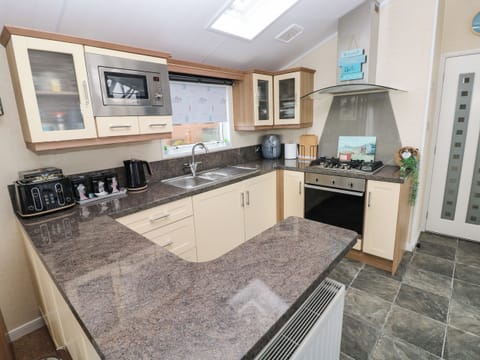 Fridge, electric kettle, toaster, cookware/dishes/utensils