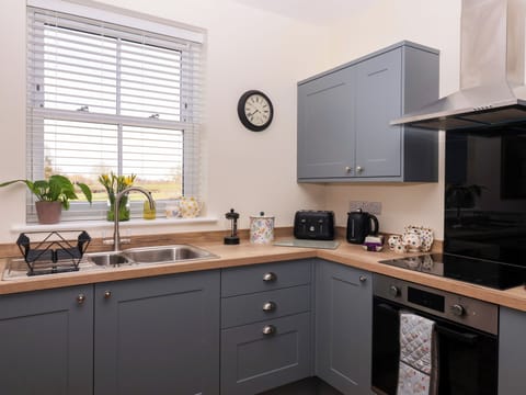 Fridge, electric kettle, toaster, cookware/dishes/utensils