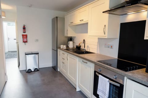 Fridge, dishwasher, electric kettle, cookware/dishes/utensils