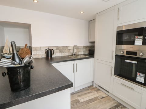 Fridge, electric kettle, toaster, cookware/dishes/utensils