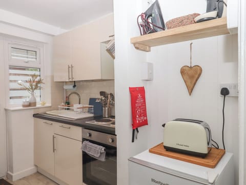 Fridge, electric kettle, toaster, cookware/dishes/utensils