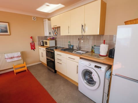 Fridge, electric kettle, toaster, cookware/dishes/utensils