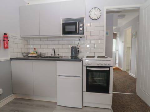 Fridge, electric kettle, toaster, cookware/dishes/utensils