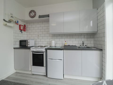 Fridge, electric kettle, toaster, cookware/dishes/utensils