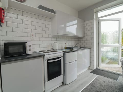 Fridge, electric kettle, toaster, cookware/dishes/utensils