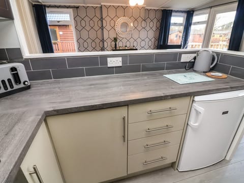 Fridge, electric kettle, toaster, cookware/dishes/utensils