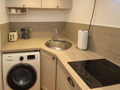 Fridge, electric kettle, toaster, cookware/dishes/utensils