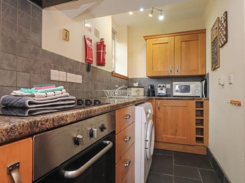 Fridge, electric kettle, toaster, cookware/dishes/utensils