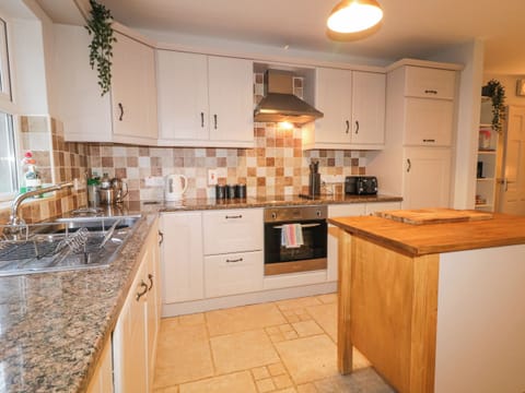 Fridge, electric kettle, toaster, cookware/dishes/utensils