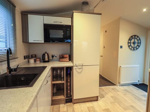 Fridge, electric kettle, toaster, cookware/dishes/utensils