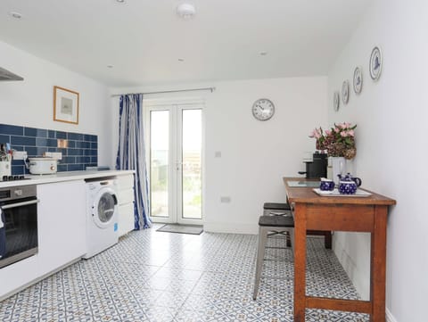 Fridge, electric kettle, toaster, cookware/dishes/utensils