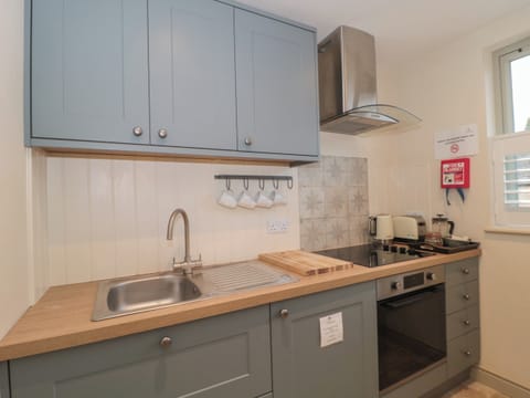 Fridge, electric kettle, toaster, cookware/dishes/utensils