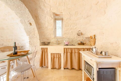 Interior Design, Furniture, Ceiling, Room, Chair, Light Fixture, Plaster, Linens, Houseplant, Wood Flooring