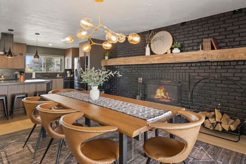 Gather, dine, and make memories in this stunning space! With a warm fireplace, modern lighting, and a sleek dining setup, this is the perfect spot for cozy meals and great conversations. Pull up a chair and stay awhile!