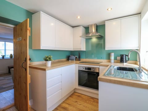 Fridge, electric kettle, toaster, cookware/dishes/utensils