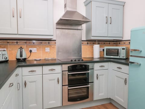 Fridge, electric kettle, toaster, cookware/dishes/utensils