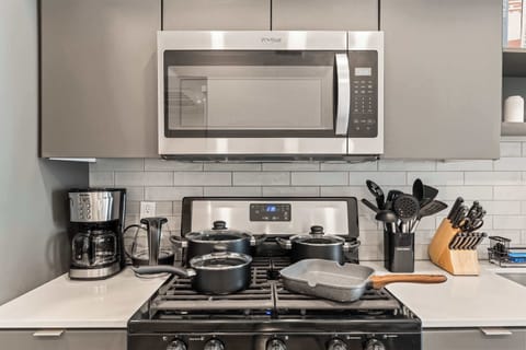 Fully equipped cooking zone with built-in oven, stovetop, and every utensil you need for a seamless culinary experience.