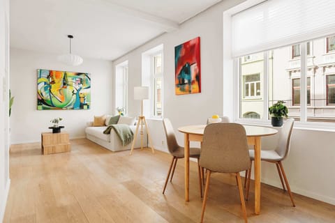 Natural light floods the space, highlighting the warm hardwood floors.
