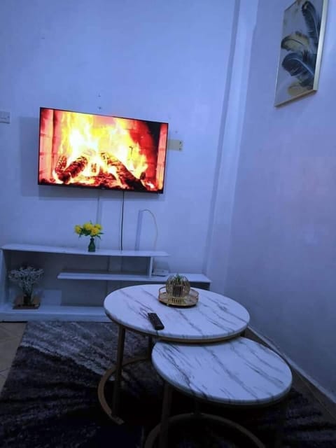 Deluxe Apartment, City View | Living area | 24-inch Smart TV with digital channels