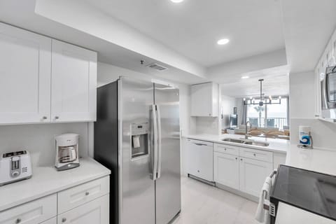 Clean, modern kitchen w/ stainless steel appliances and plenty of prep space.
