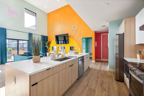 Tequila Sunrise unit: Open concept living room / kitchen / murphy beds