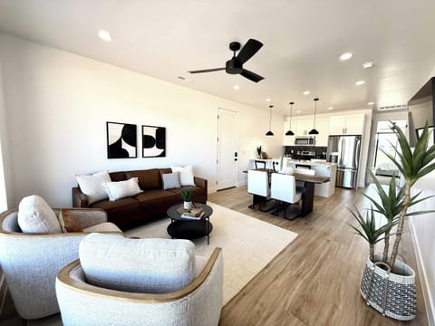 Experience luxury and comfort in this open-concept living space at Holiday H1 at Catori, perfect for entertaining and family gatherings.