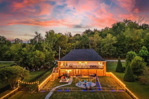 Where evenings glow and memories flow — your private backyard oasis is just as fun as the indoors!