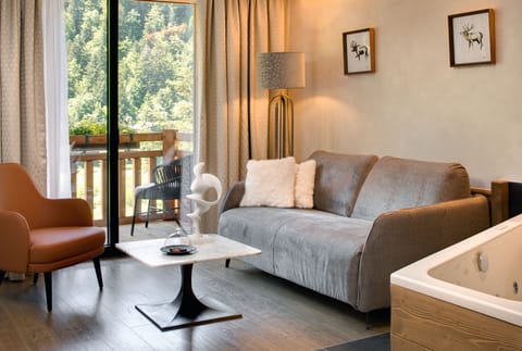 Deluxe Double Room, Mountain View | Living area | 49-inch flat-screen TV with cable channels