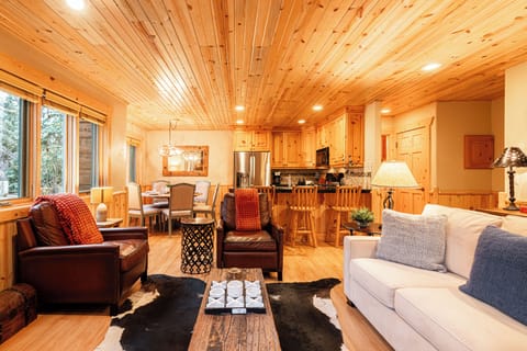 Main Living Space with Queen Sofa Sleeper, Gas Fireplace, TV, & Patio Access