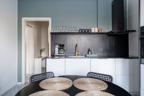 The kitchen is fully equipped, including cooking utensils and crockery.