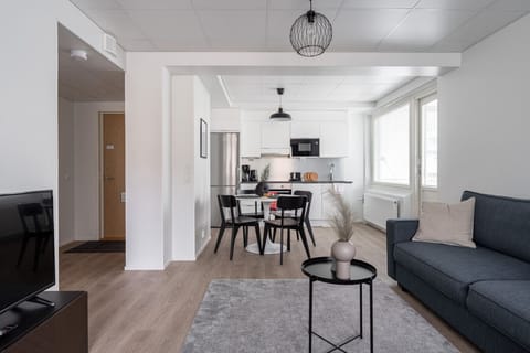 Apartment living room, dining area and kitchen