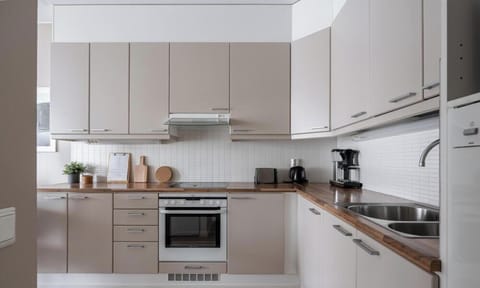 The kitchen is fully equipped with cooking utensils, crockery, oven, stove, microwave, fridge, etc.