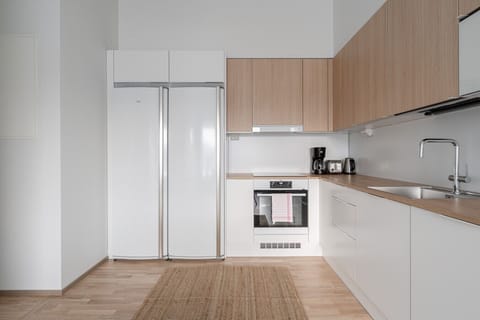 Apartment kitchen with oven, stove, microwave, dishwasher etc.