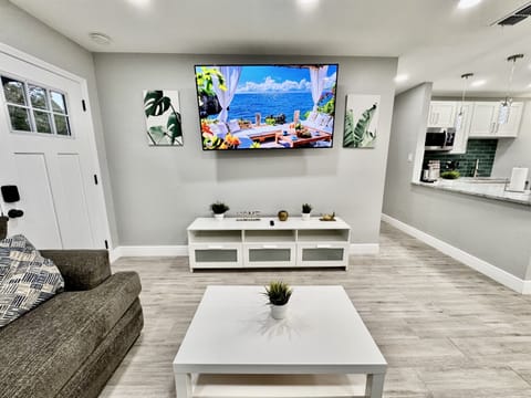 A large smart TV takes center stage, mounted on the wall or perched on a stylish entertainment console.