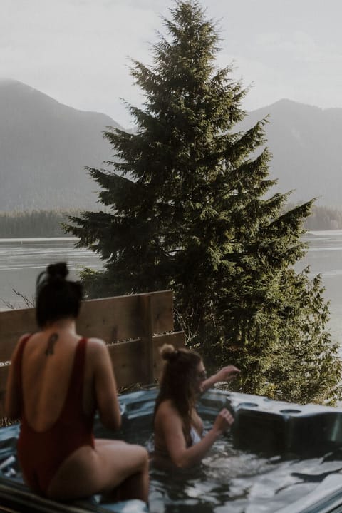 Hot tub overlooking the water, steps from the door